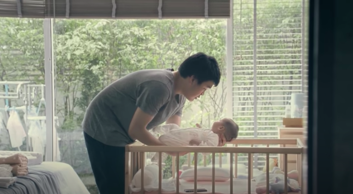 father holding son