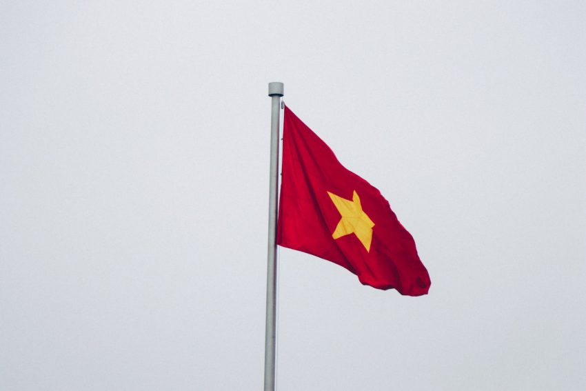 red and yellow flag close up photography